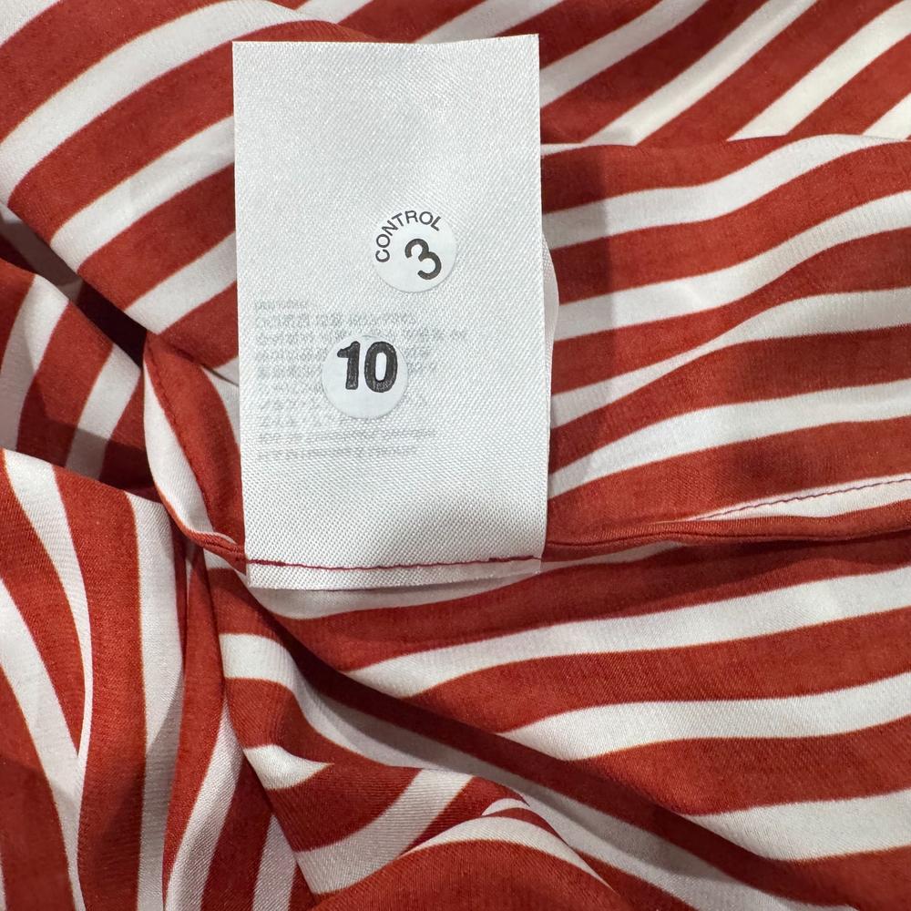 Clothing material label view on H & M women's brown striped crop top size 0