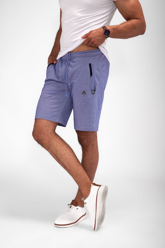 SCR Sportswear men's Urban Stride 11-inch inseam athletic shorts in heather blue with drawstring waist and zippered pockets, modeled front view.